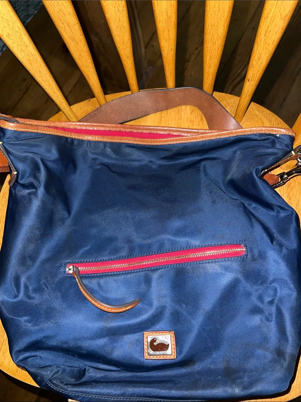 Dooney & Bourke Navy Nylon Messenger Bag with Brown Leather Trim and Red Accents